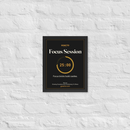 Focus Session Framed Print, Brick Ring design, 11x14 in a black frame on a white brick wall: ring of amber bricks around a 25:00 timer, on charcoal, the line 'Focus bricks build castles.' and 'We Are / Growing Ourselves and Contributing To Others' above goacto.com