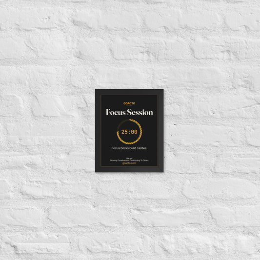 Focus Session Framed Print, Brick Ring design, 8x10 in a black frame on a white brick wall: ring of amber bricks around a 25:00 timer, on charcoal, the line 'Focus bricks build castles.' and 'We Are / Growing Ourselves and Contributing To Others' above goacto.com