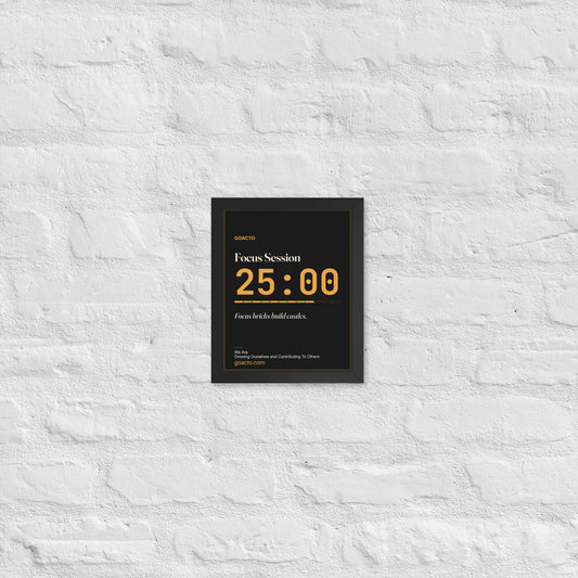 Focus Session Framed Print, Type design, 8x10 in a black frame on a white brick wall: oversized amber 25:00 above a segmented progress bar, on charcoal, the line 'Focus bricks build castles.' and 'We Are / Growing Ourselves and Contributing To Others' above goacto.com