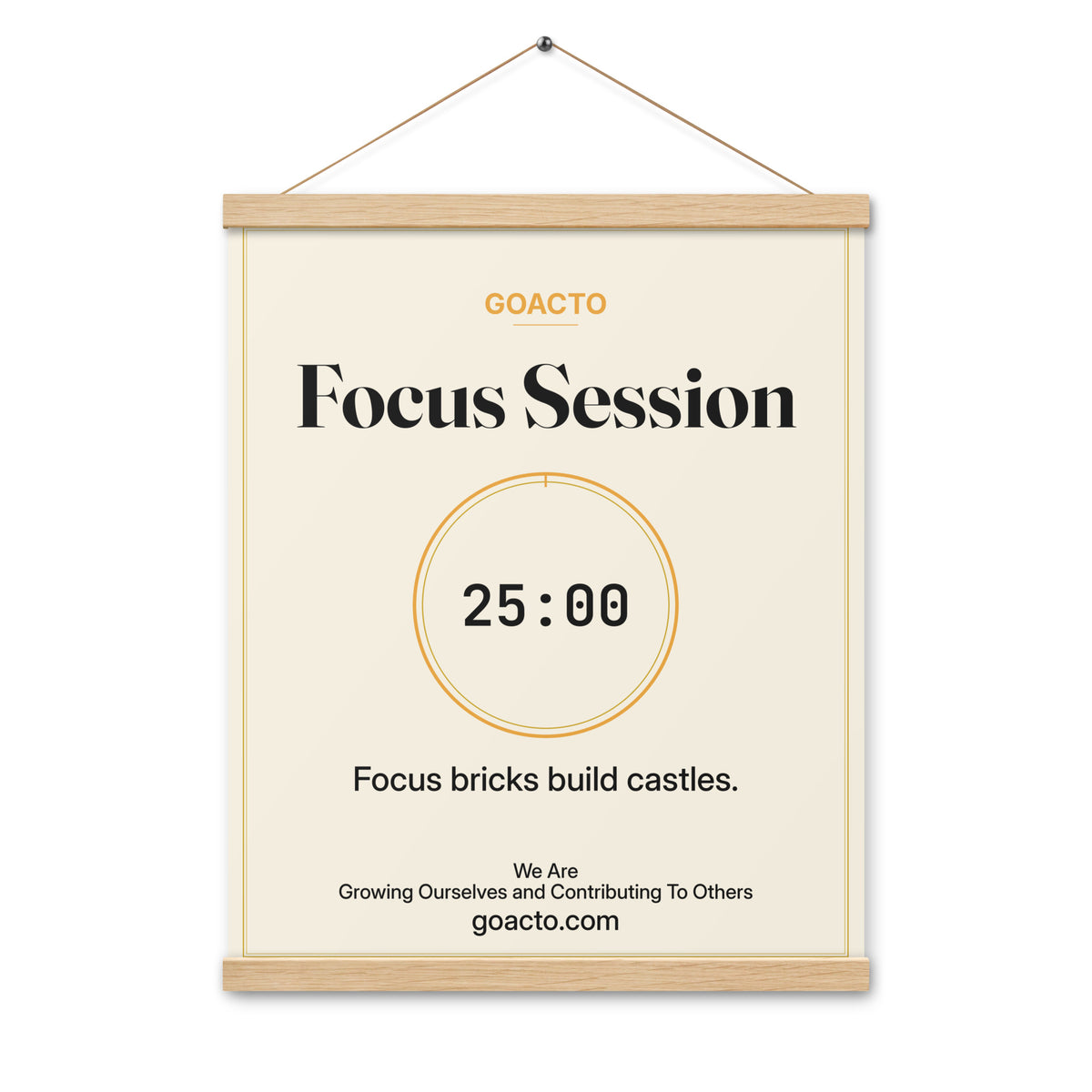 Focus Session Oak Hanger Poster, Cream design, 16x20 on natural oak wood bars: thin gold ring around a dark 25:00 timer on a light cream background, the line 'Focus bricks build castles.' and 'We Are / Growing Ourselves and Contributing To Others' above goacto.com